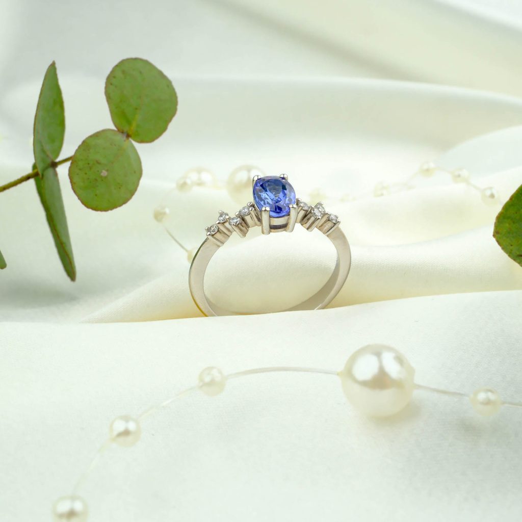 Front view of Tanzanite Natural Stone Diamond-Embellished Gold Women's Ring, showcasing its elegant design and vibrant blue-violet color.