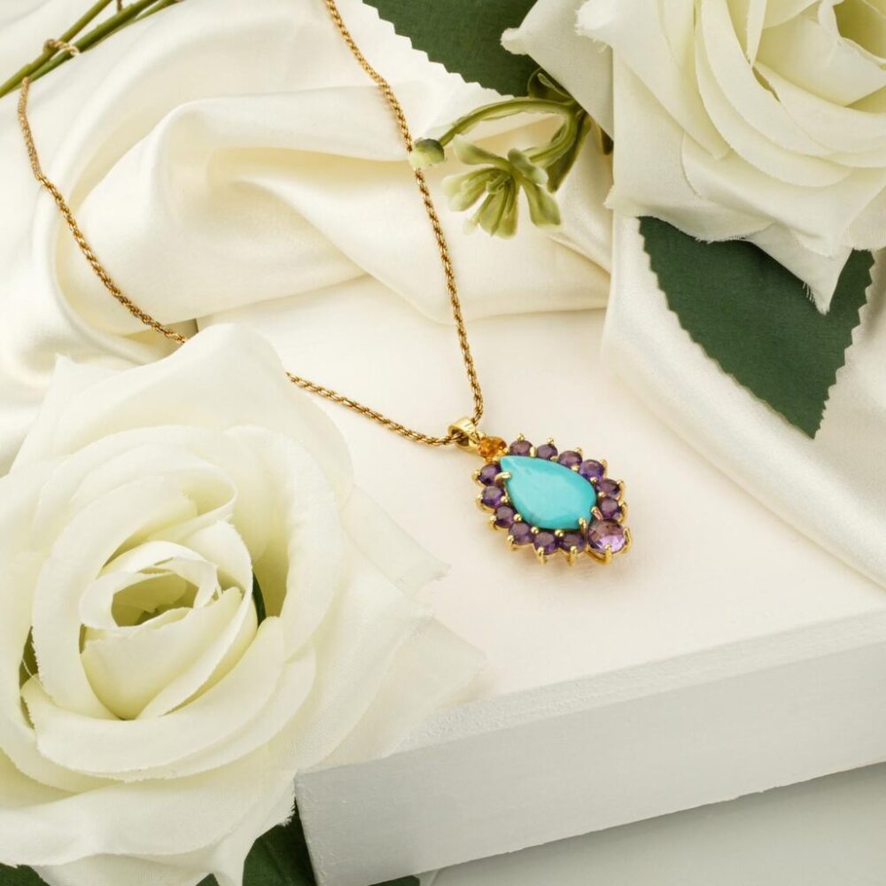 Gold-plated 925 silver necklace with teardrop turquoise pendant haloed by amethyst and citrine.