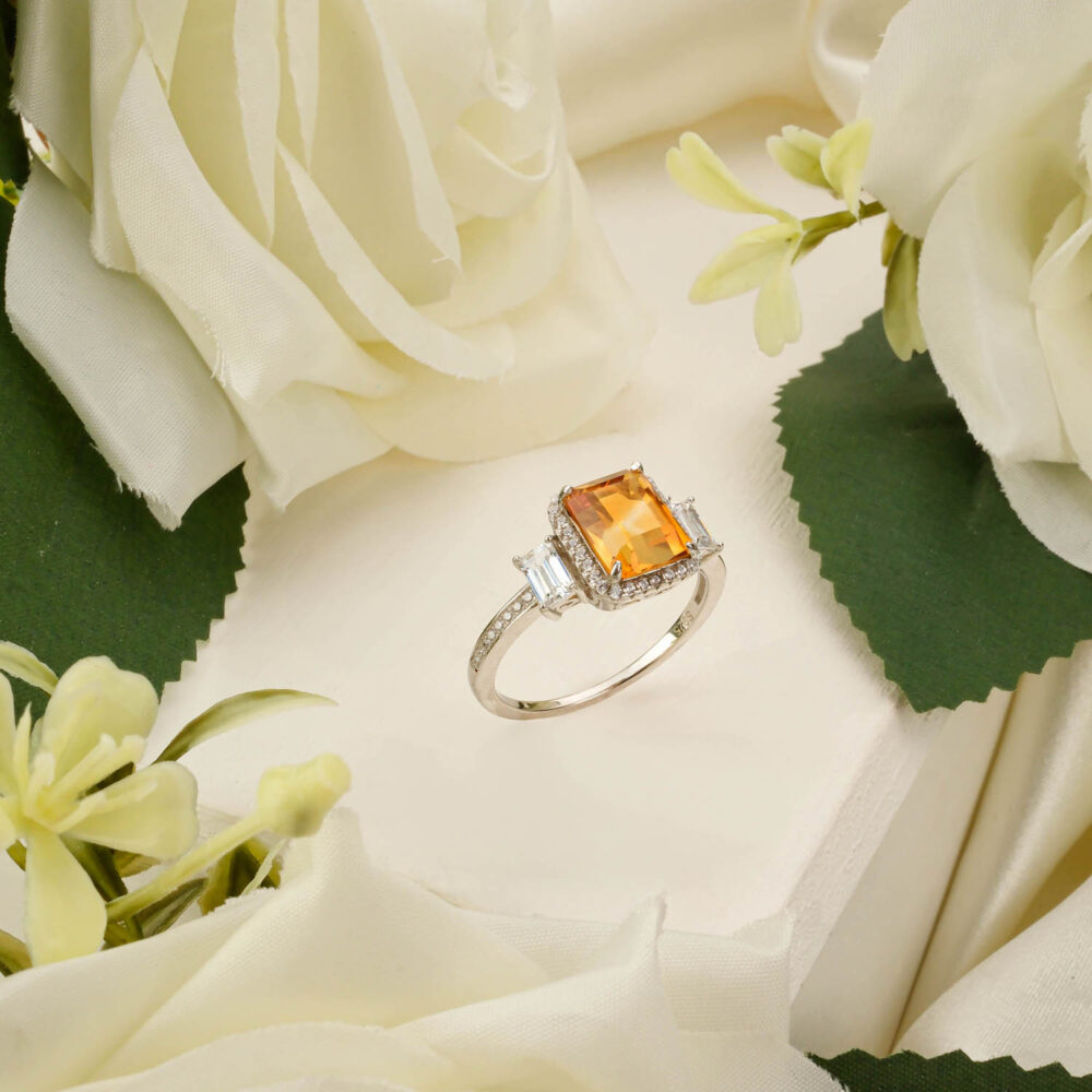 Citrine solitaire ring in 925 sterling silver with baguette accents.