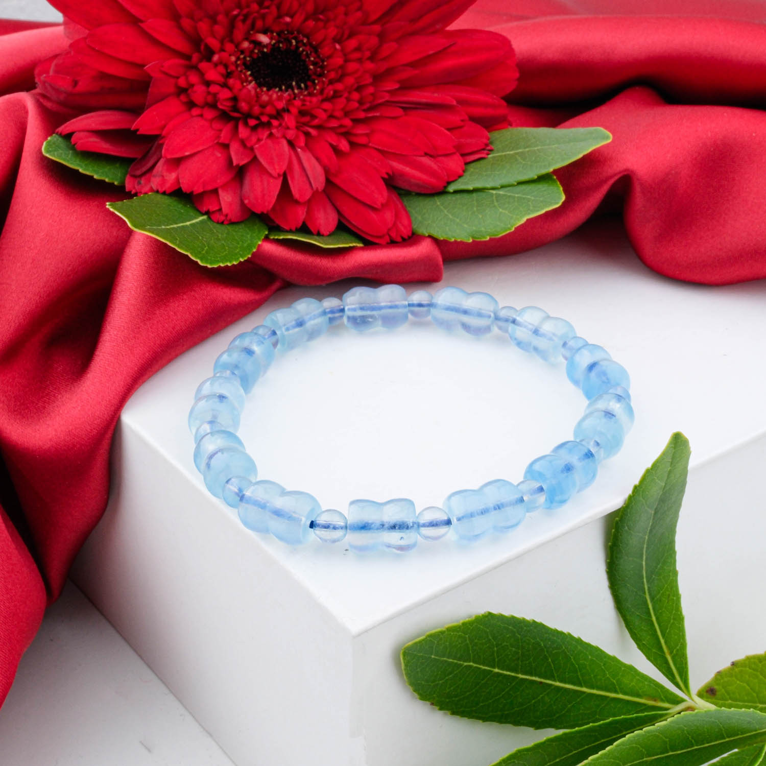 Premium 5A+ Aquamarine bracelet with special faceted rondelle light blue beads, shown on a white box.