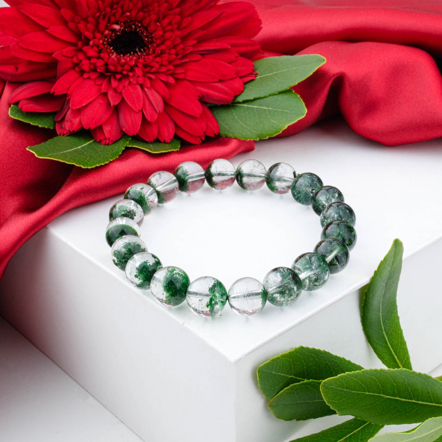 Premium 5A+ Green Garden Quartz (Lodolite) bracelet 8-9mm with clear beads showing green inclusions, on white box.