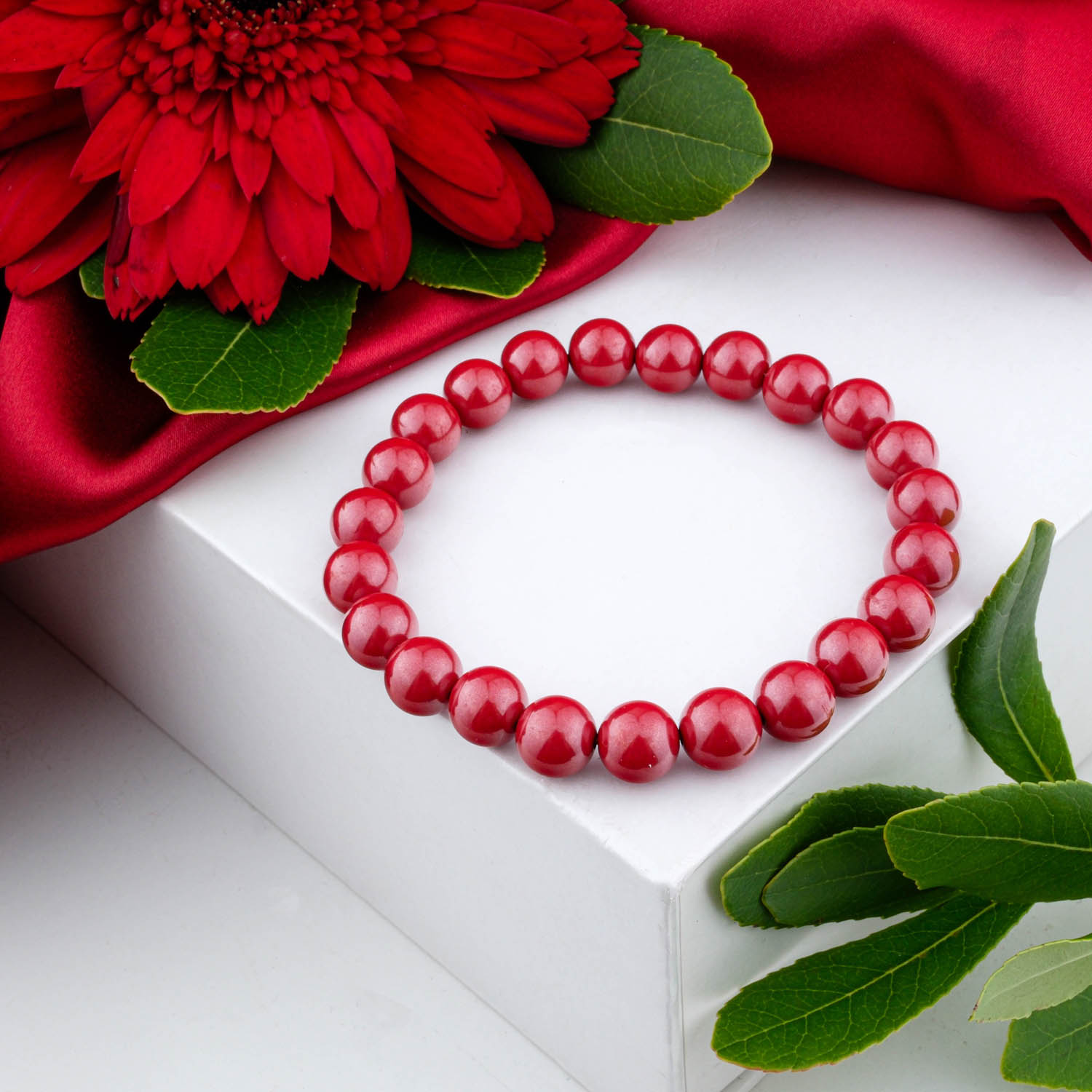 5a-quality-cinnabar-pixiu-bracelet-8mm A 5A+ quality 8mm natural cinnabar beaded bracelet with a Pi Xiu charm, on a white box.