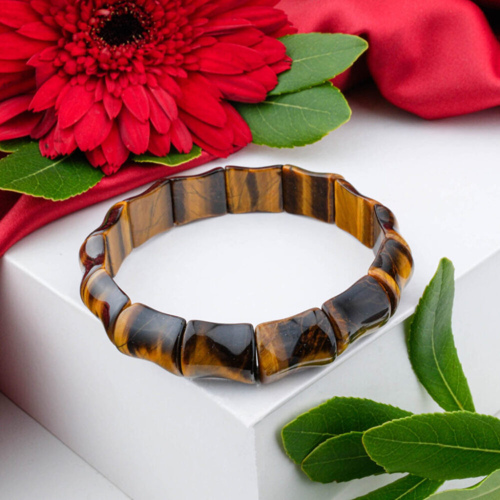 Premium 5A+ Tiger's Eye bracelet with curved, golden-brown chatoyant links in Rolex-style, on white box.