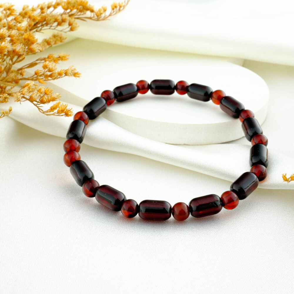 Certified natural amber mini-capsule adult bracelet on neutral fabric