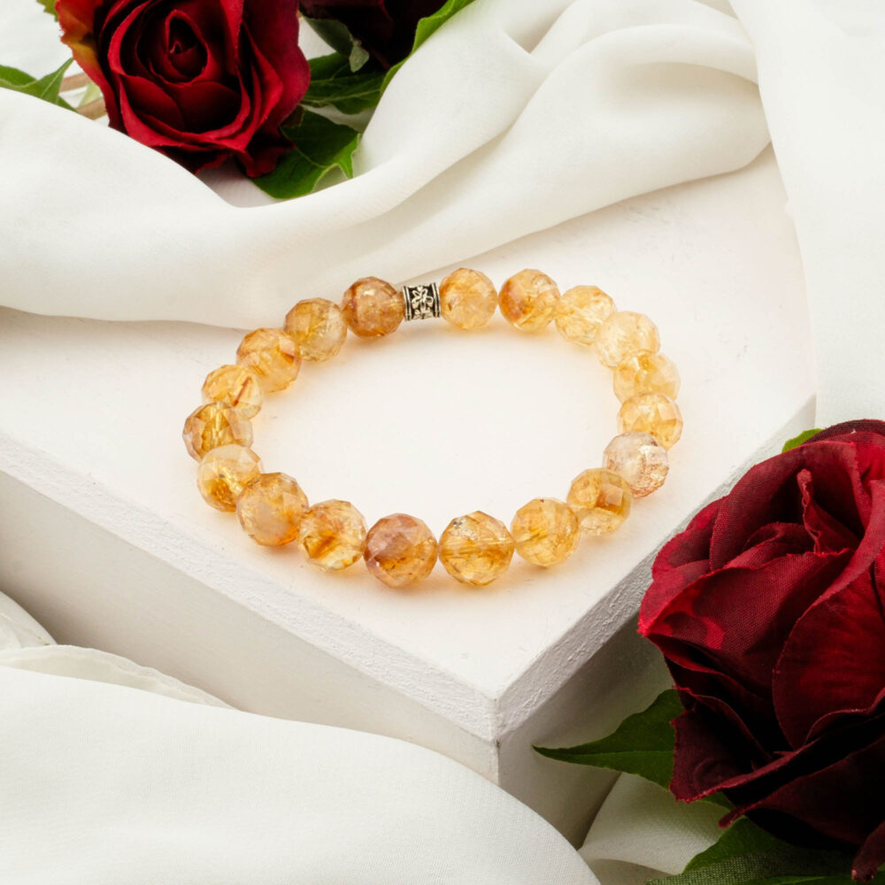 Citrine bracelet with 10–11 mm 5A+ faceted beads on elastic, silver spacer visible