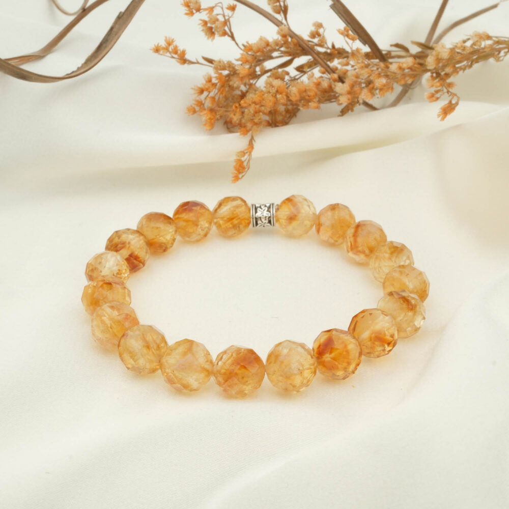 Citrine bracelet with 11–12 mm 5A+ faceted beads on elastic, silver spacer visible
