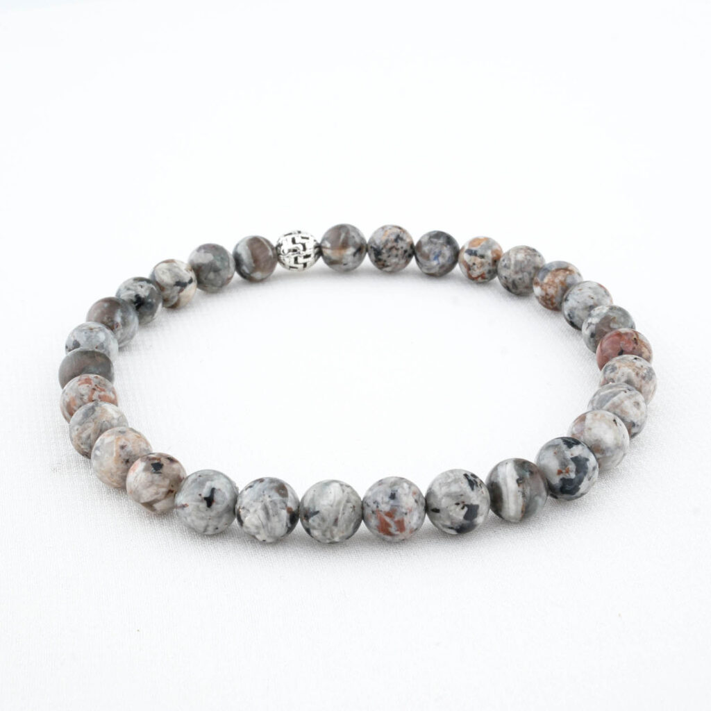 Close-up of a 6mm Yooperlite bracelet showing the grey sodalite stone with a silver clasp.