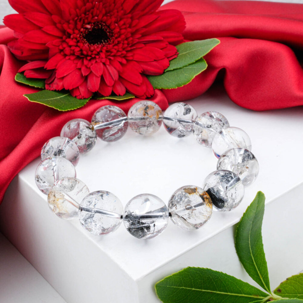 Large 19-20mm Herkimer Diamond bracelet with clear beads and black anthraxolite inclusions, shown on white box.