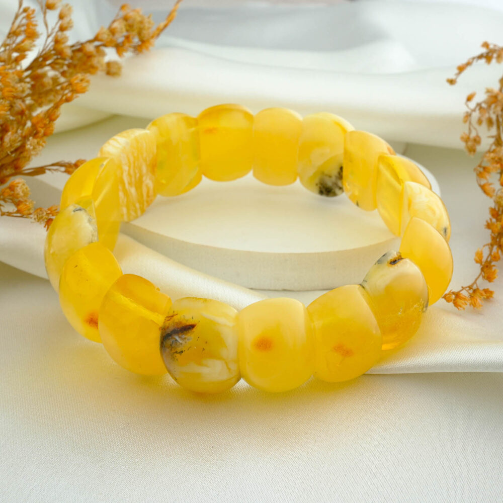 Certified lemon amber “Rolex” panel bracelet for adults on neutral fabric