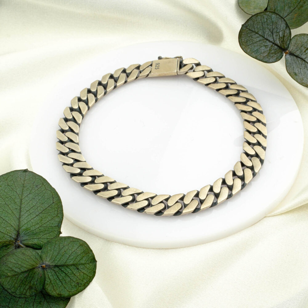 Matte square-link 925 sterling silver bracelet with box clasp on neutral backdrop