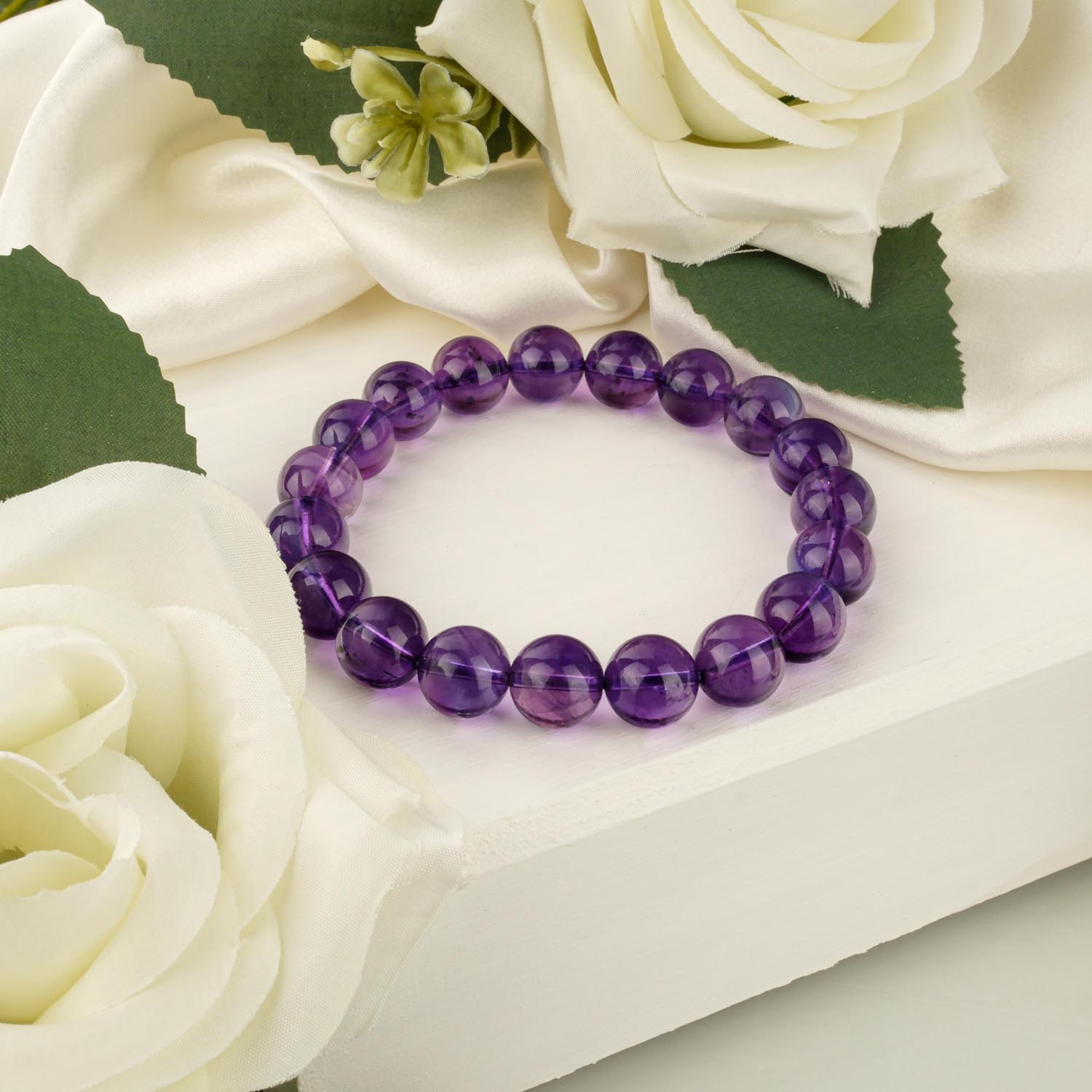 10a-plus-vip-amethyst-bracelet-8mm-beads 10A+ VIP quality amethyst bracelet with 8-9mm deep purple beads on white surface