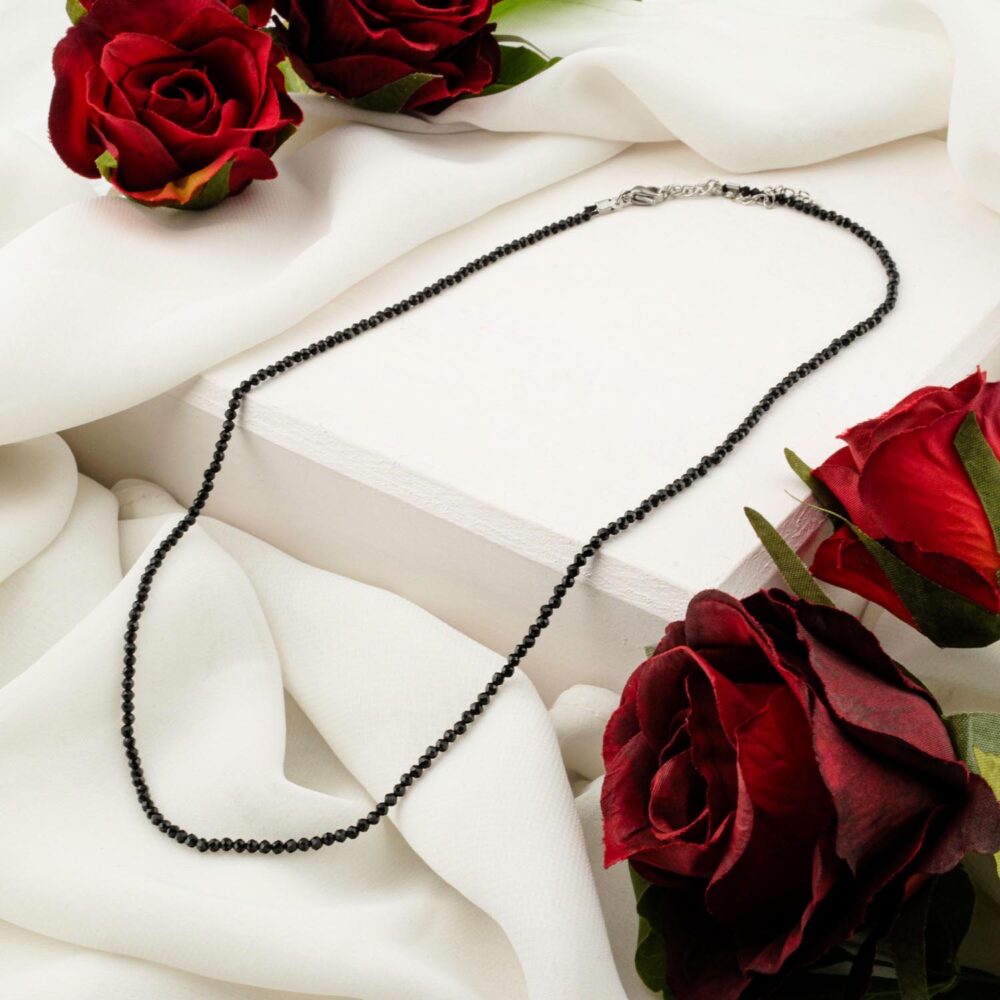 Delicate 2mm black spinel faceted bead necklace on white display