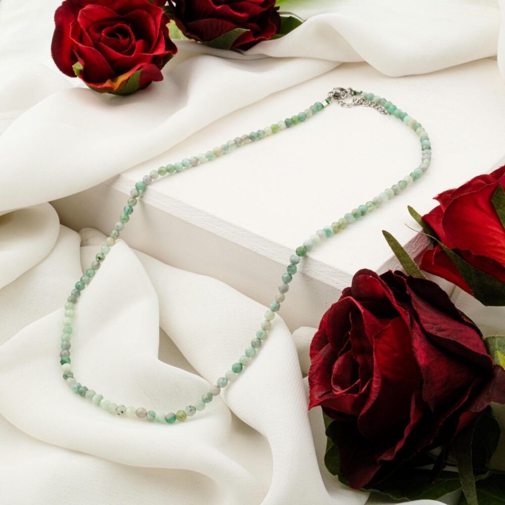 Delicate 3-4mm natural emerald faceted bead necklace on white display