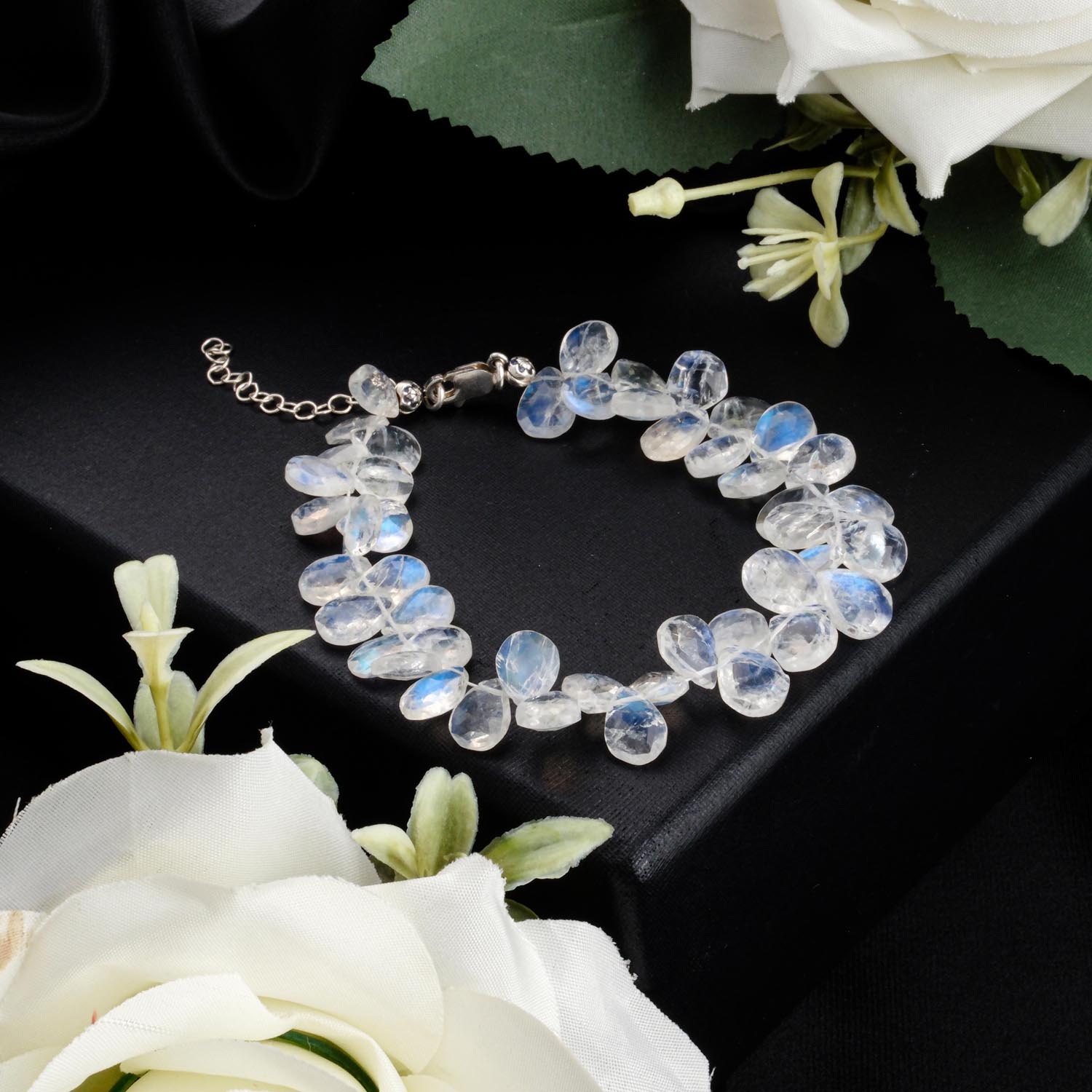 5a-rainbow-moonstone-teardrop-bracelet-925-silver 5A+ rainbow moonstone bracelet with faceted teardrop beads and 925 silver clasp on black