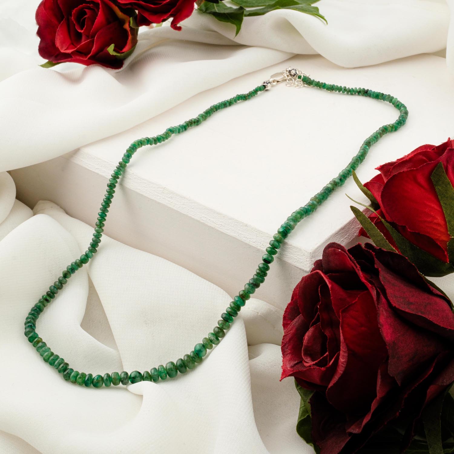 7a-plus-zambian-emerald-necklace-faceted-beads 7A+ quality Zambian emerald necklace with faceted green gemstone beads on white