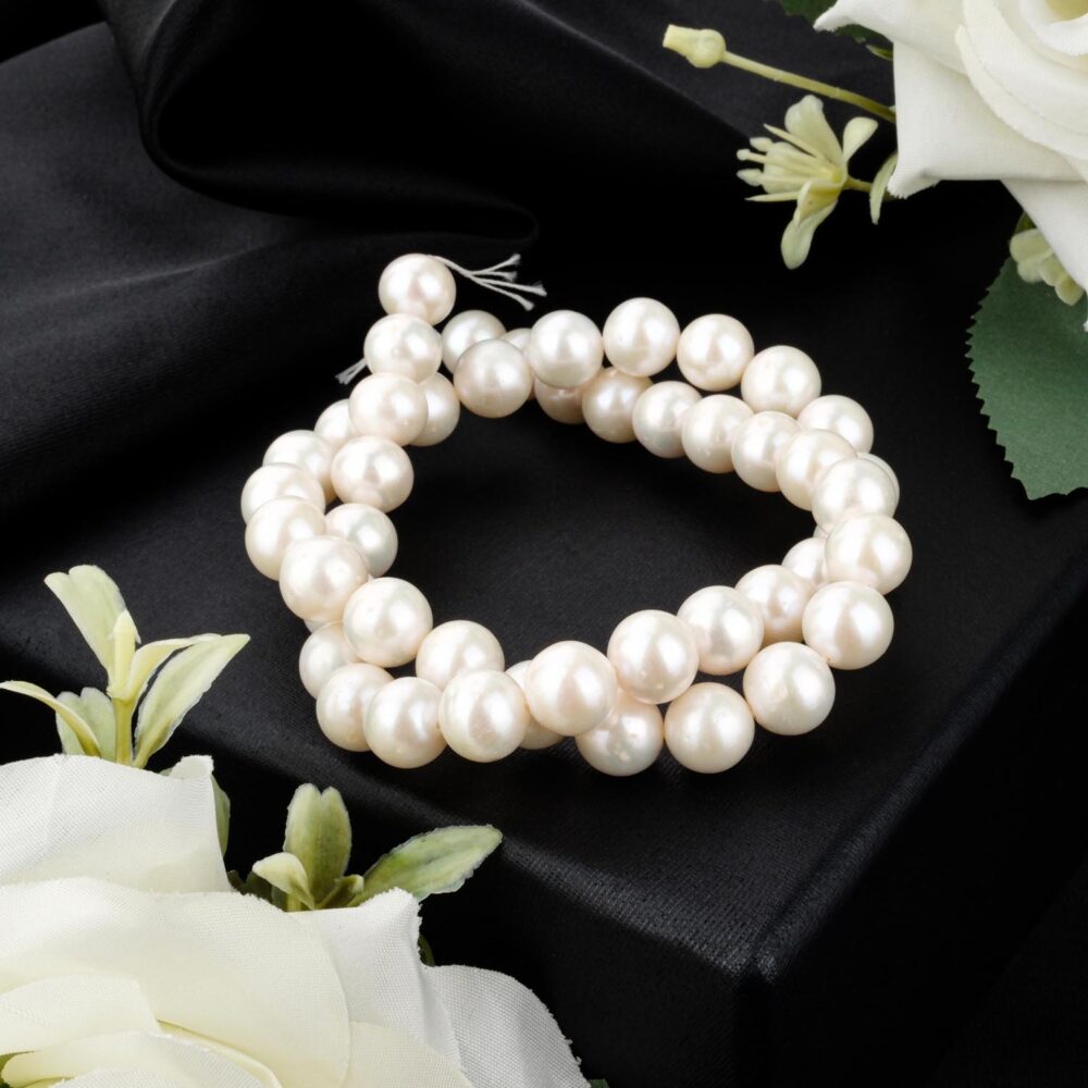 A+ quality 9-10mm saltwater pearl strand with high luster on a black box