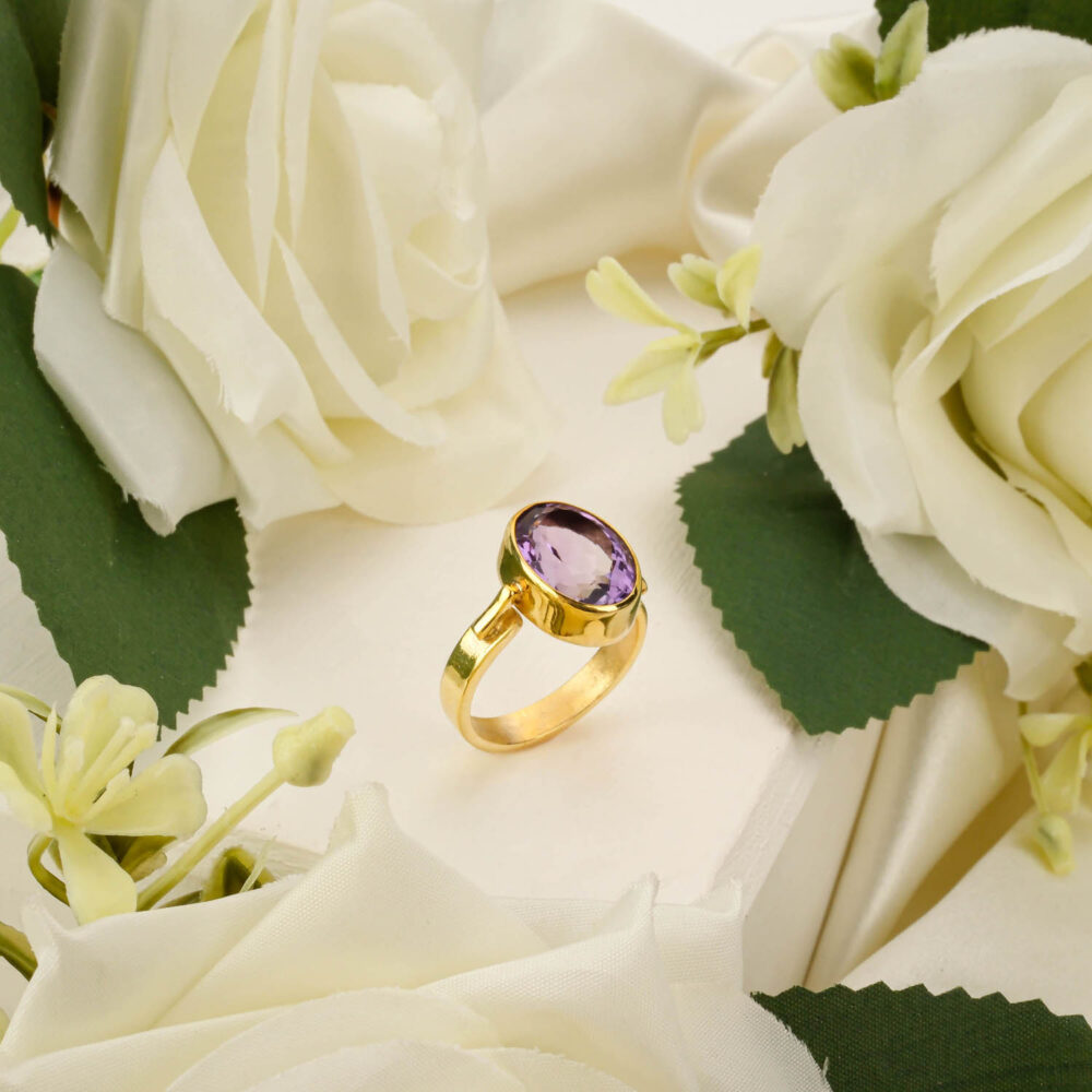 Modern gold-plated 925 silver ring featuring a round Amethyst cabochon in an architectural setting