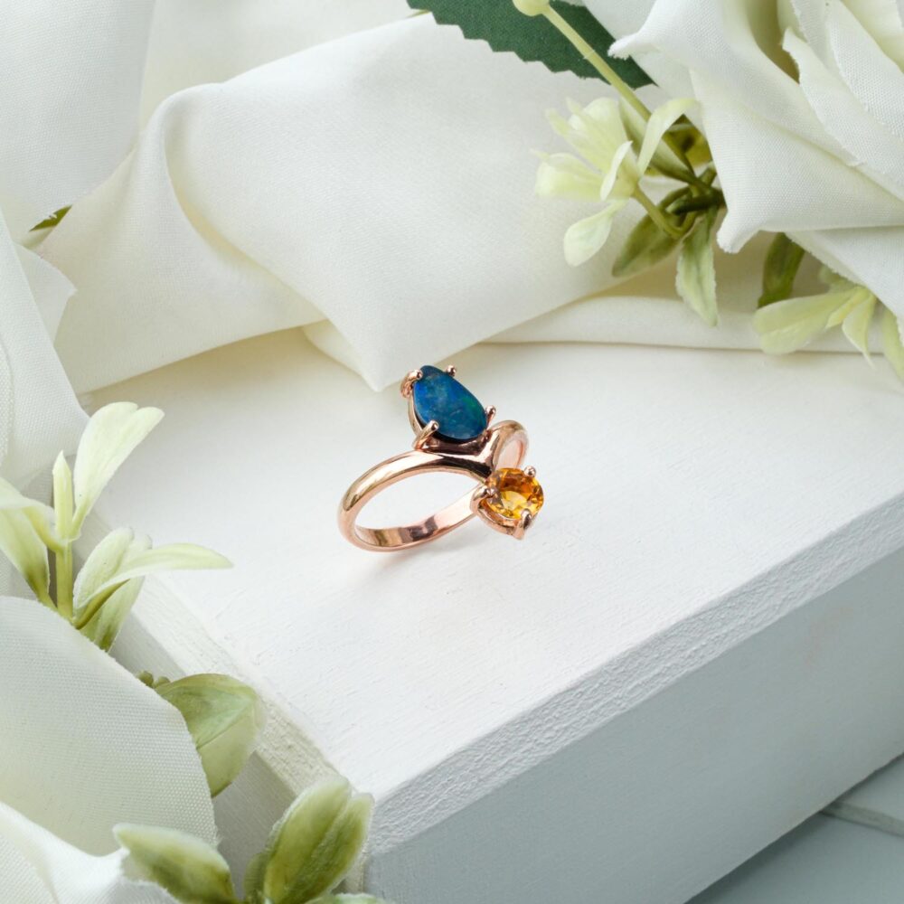 Genuine Boulder Opal ring with Citrine accents in rose gold-plated 925 sterling silver on white