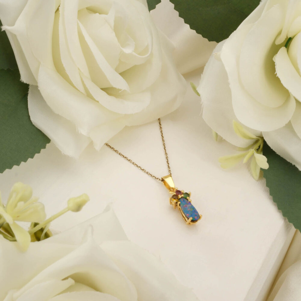 Genuine Australian Boulder Opal pendant with Tourmaline accents in gold-plated 925 sterling silver on white