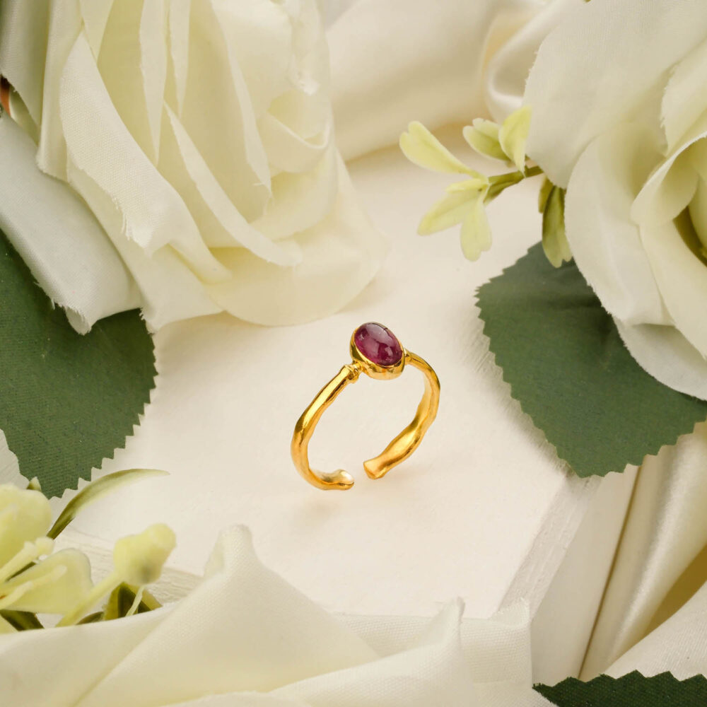 Emerald-cut pink tourmaline ring in gold-plated 925 sterling silver on white background