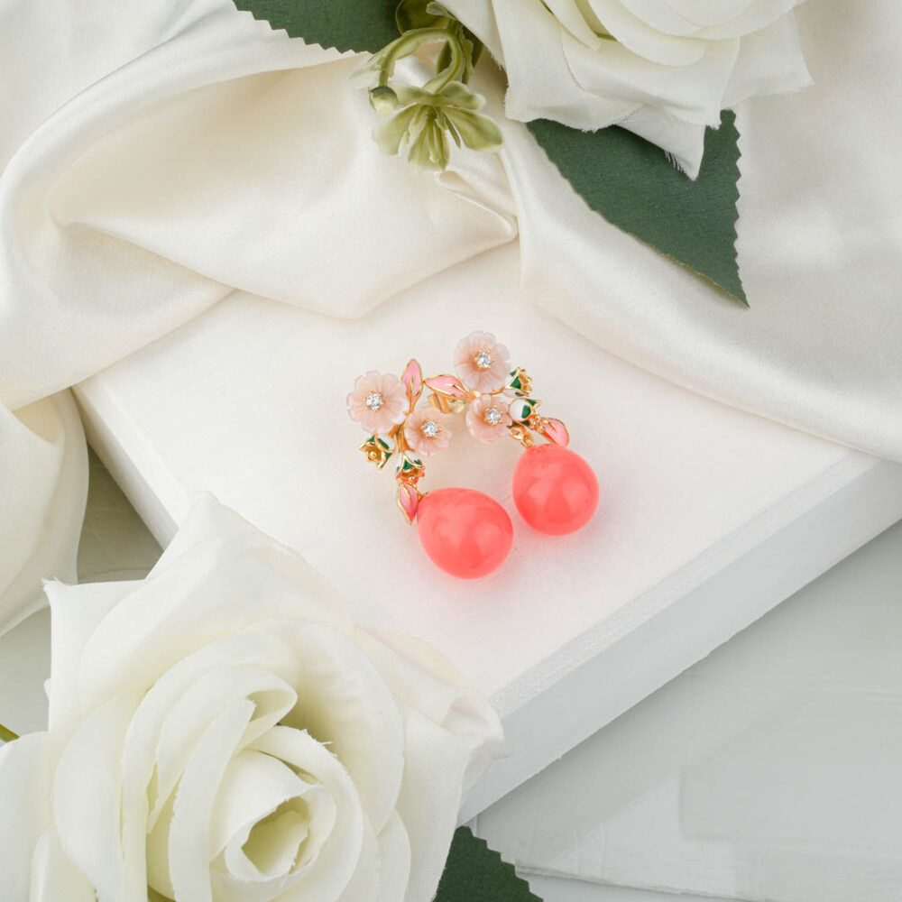 Handcrafted enamel floral drop earrings in 925 sterling silver with gold finish on white display