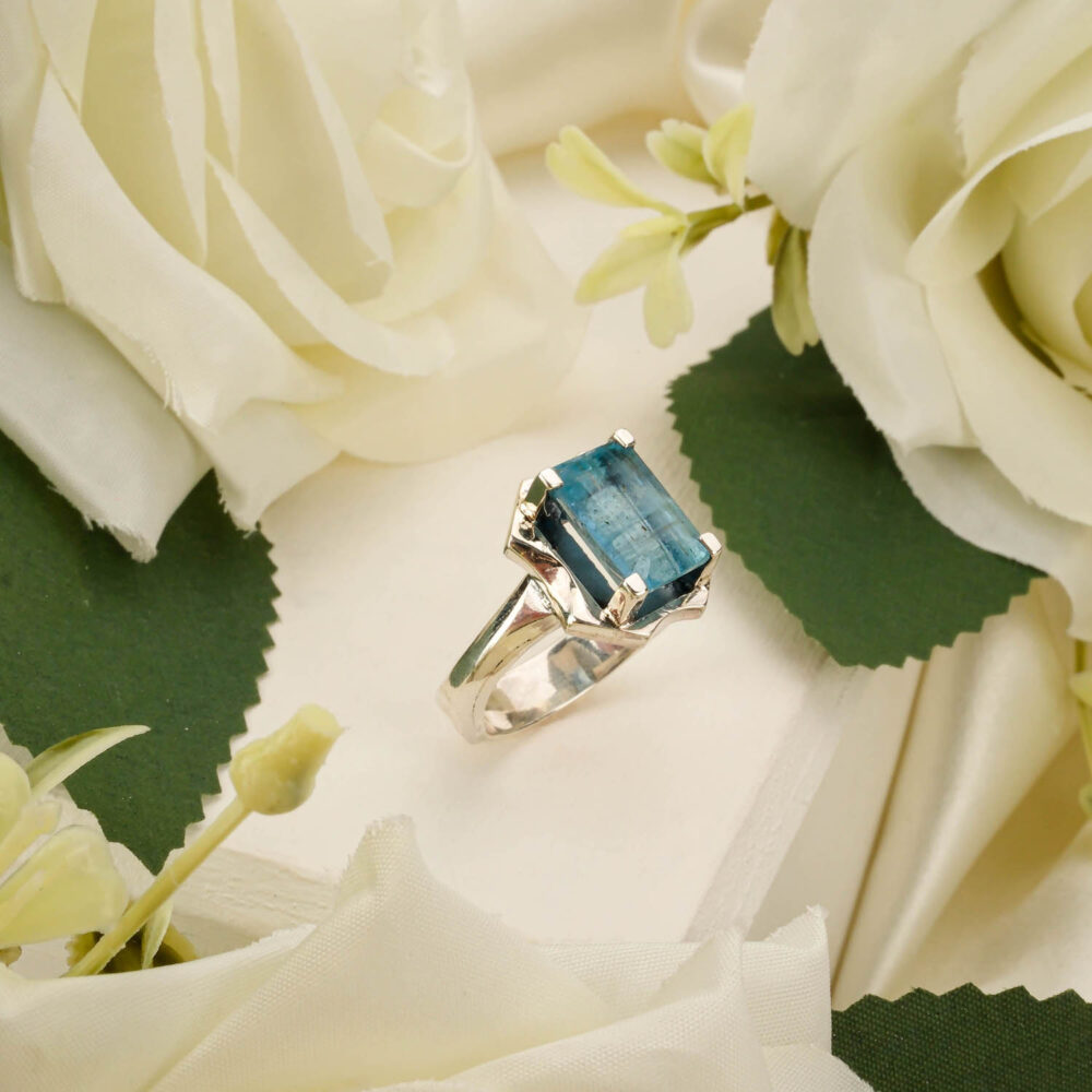 Handcrafted unisex ring featuring a genuine aquamarine gemstone in 925 sterling silver on white