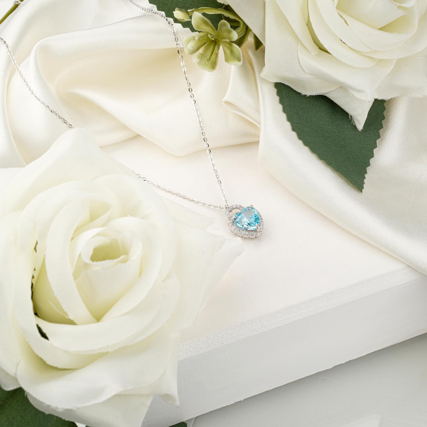 ice-cut-blue-topaz-heart-necklace-925-silver Certified "Ice Cut" heart-shaped blue topaz pendant necklace in 925 sterling silver on white