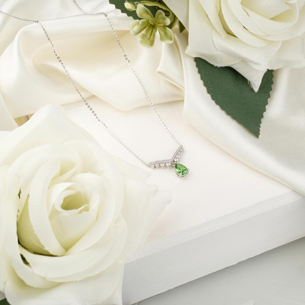 Certified "Ice Cut" teardrop peridot pendant necklace with V-shape halo in 925 sterling silver