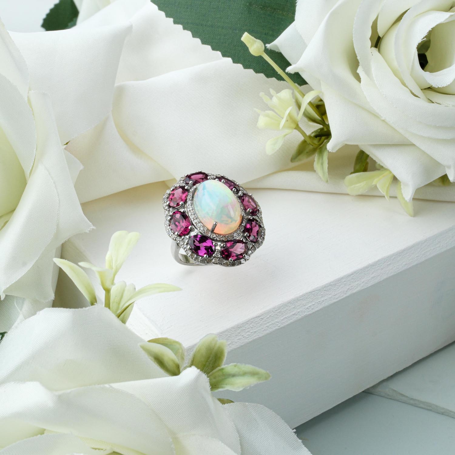 opal-rubellite-diamond-silver-ring-halo Oval opal ring with pink rubellite tourmaline halo and diamond accents in 925 sterling silver on white