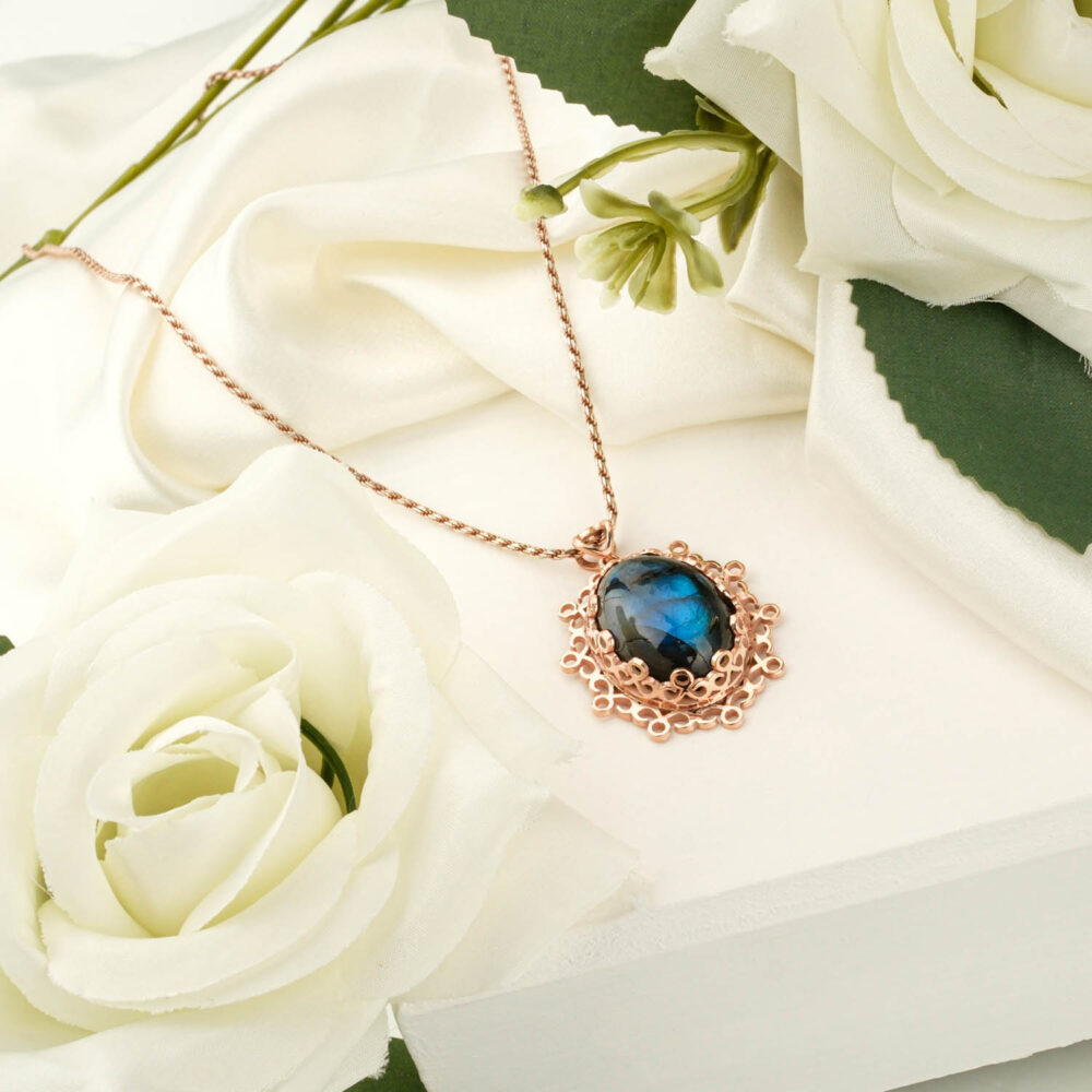 Ornate labradorite pendant necklace with blue flash in a 925 silver rose gold finish