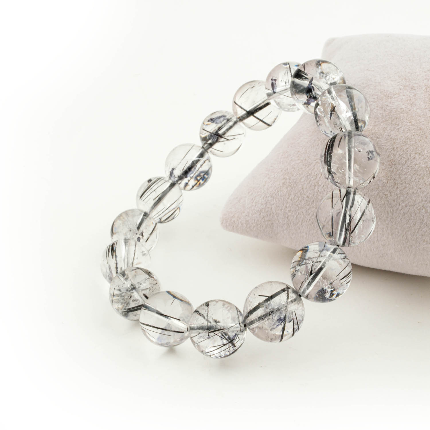 pulsera-cuarzo-turmalinado-negro-6a-11mm Pulsera de cuarzo turmalinado negro 6A+ con cuentas de 10-11mm sobre fondo blanco