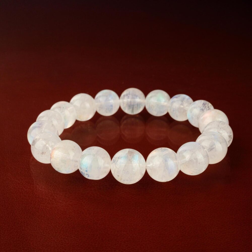 Pulsera de piedra de luna calidad 8A+ con cuentas de 9-10mm de alto brillo sobre fondo blanco