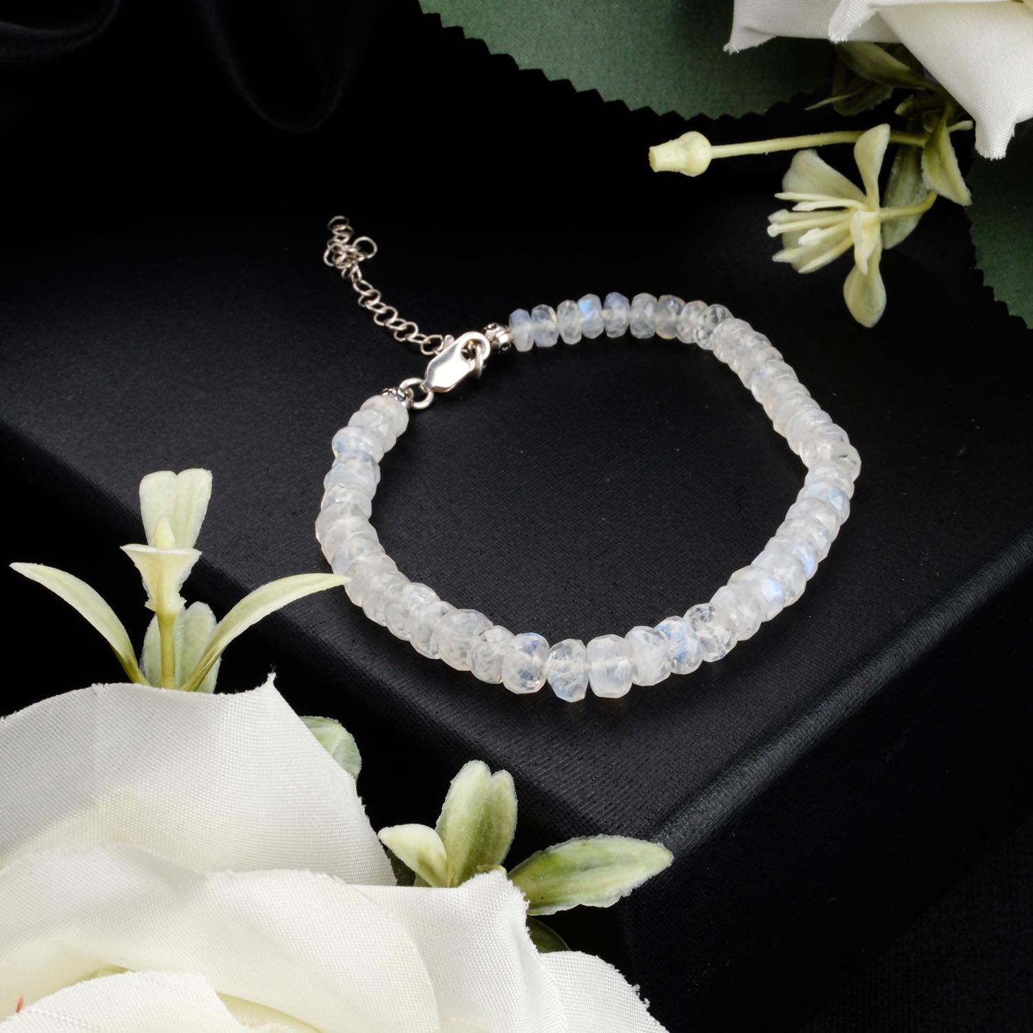 rainbow-moonstone-rondelle-bracelet-925-silver-adjustable 4mm faceted rainbow moonstone rondelle bracelet with 925 sterling silver adjustable clasp on black