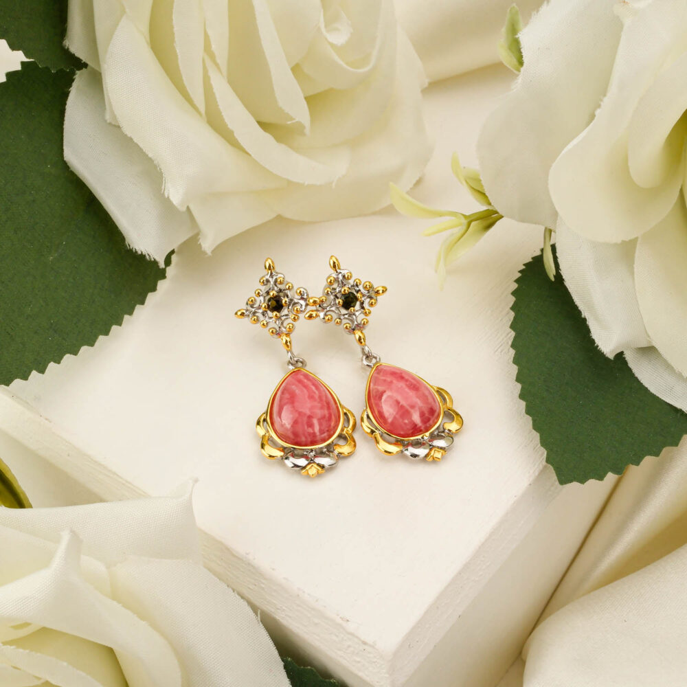 Ornate drop earrings featuring pink rhodochrosite teardrops and green tourmaline accents in silver and gold