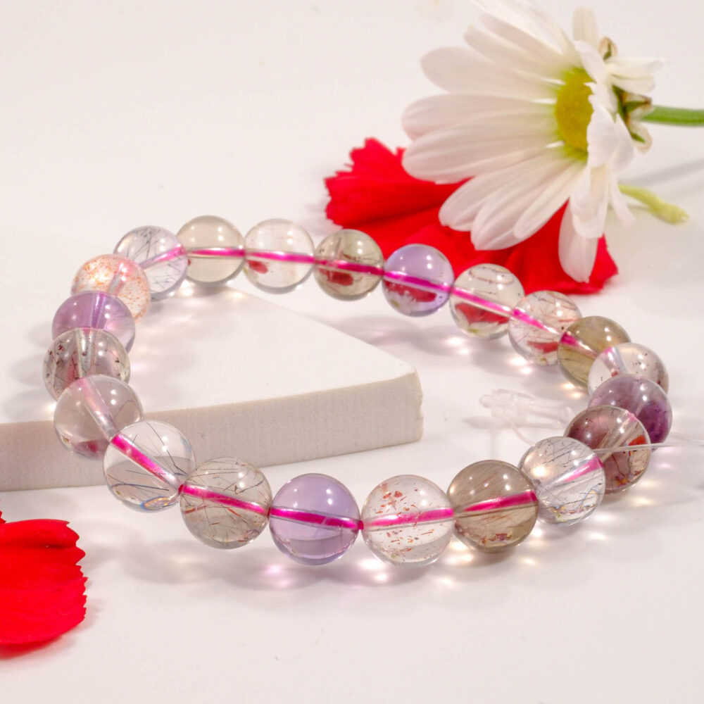 5A quality Super Seven (Melody Stone) bracelet with 7-8mm multi-mineral beads on white
