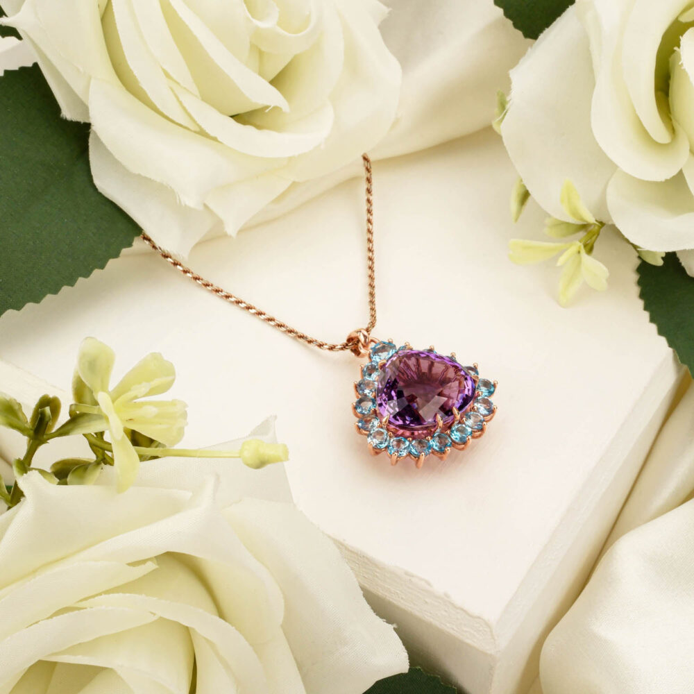 Teardrop amethyst and round Swiss blue topaz pendant necklace in rose gold-plated 925 silver on white
