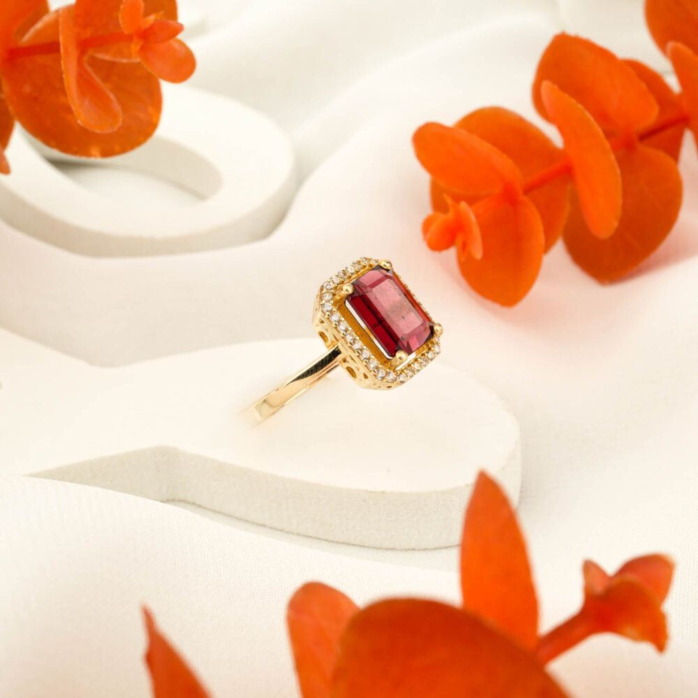 Emerald cut natural garnet ring with halo setting in 14K gold