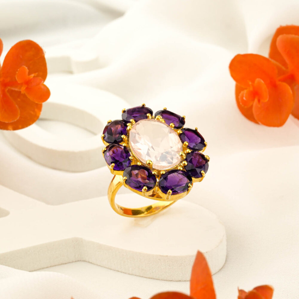 Gold-plated 925 sterling silver Toi et Moi ring featuring round rose quartz and amethyst cabochons on white background