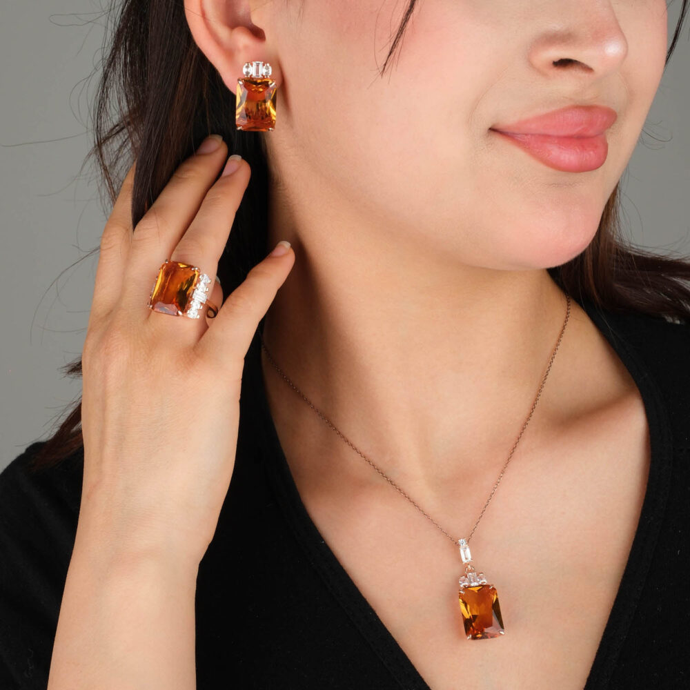 Rose gold plated 925 sterling silver jewelry set including ring earrings and necklace featuring large emerald cut color changing zultanite