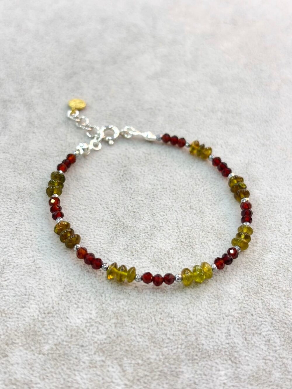 Natural faceted green tourmaline and red agate beaded bracelet with silver spacers