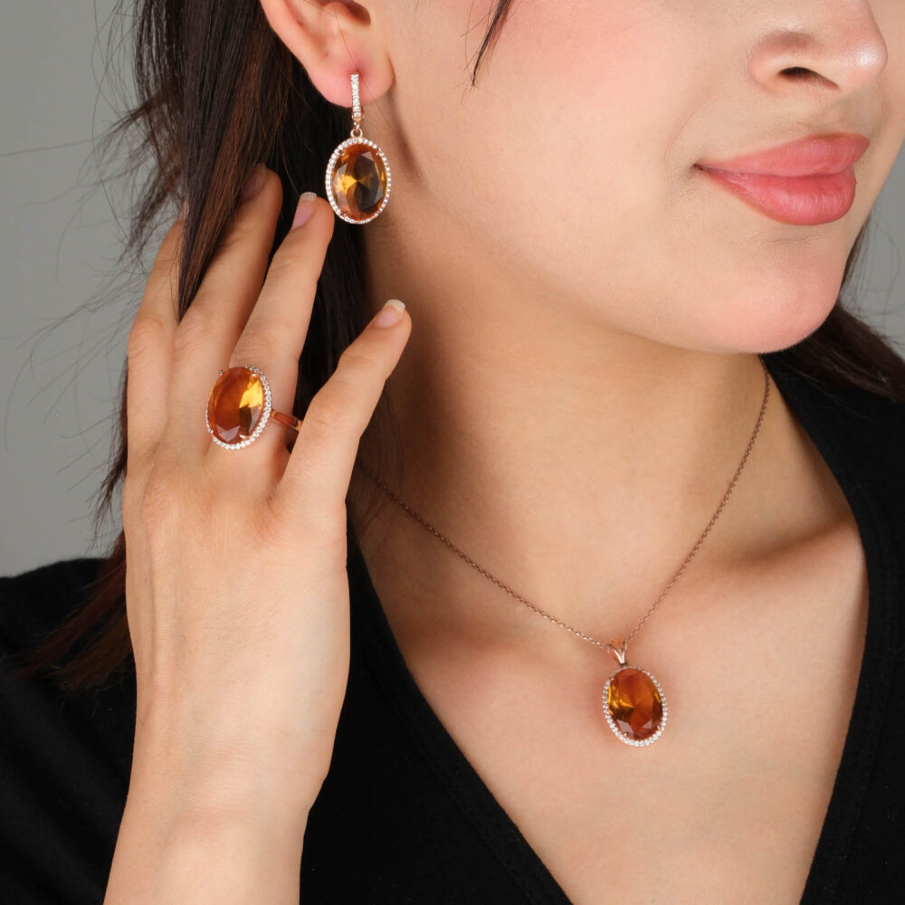 Rose gold plated 925 sterling silver jewelry set including ring earrings and necklace featuring oval cut color changing zultanite with halo