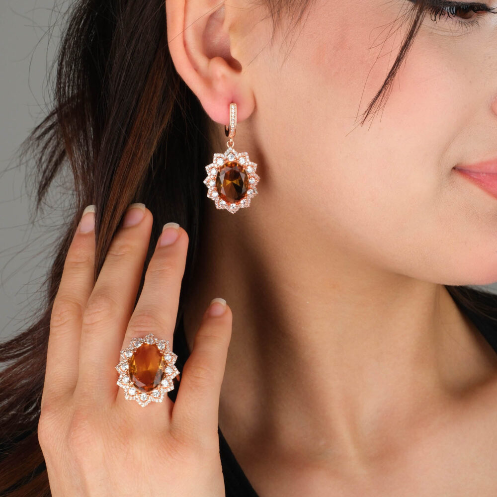 Rose gold plated 925 sterling silver ring and earrings featuring oval zultanite with a sparkling crystal floral sunburst halo