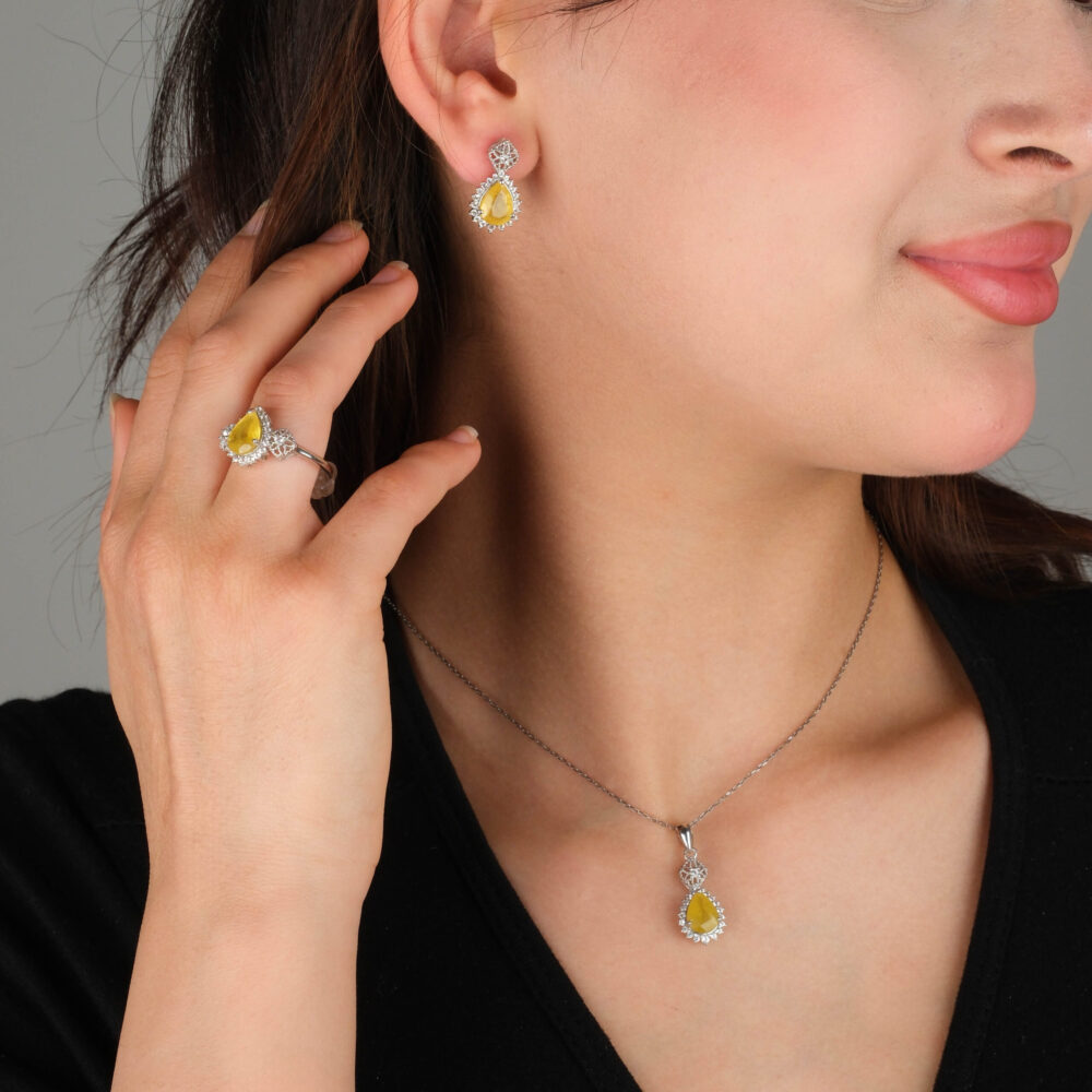 925 sterling silver jewelry set including necklace ring and earrings featuring natural pear cut yellow sapphire with crystal accents