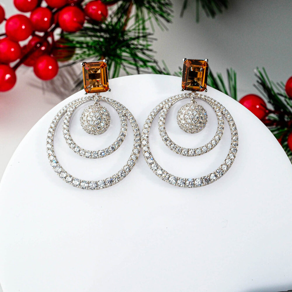 Luxury 925 sterling silver earrings featuring rectangular Zultanite stones and sparkling double crystal hoops.